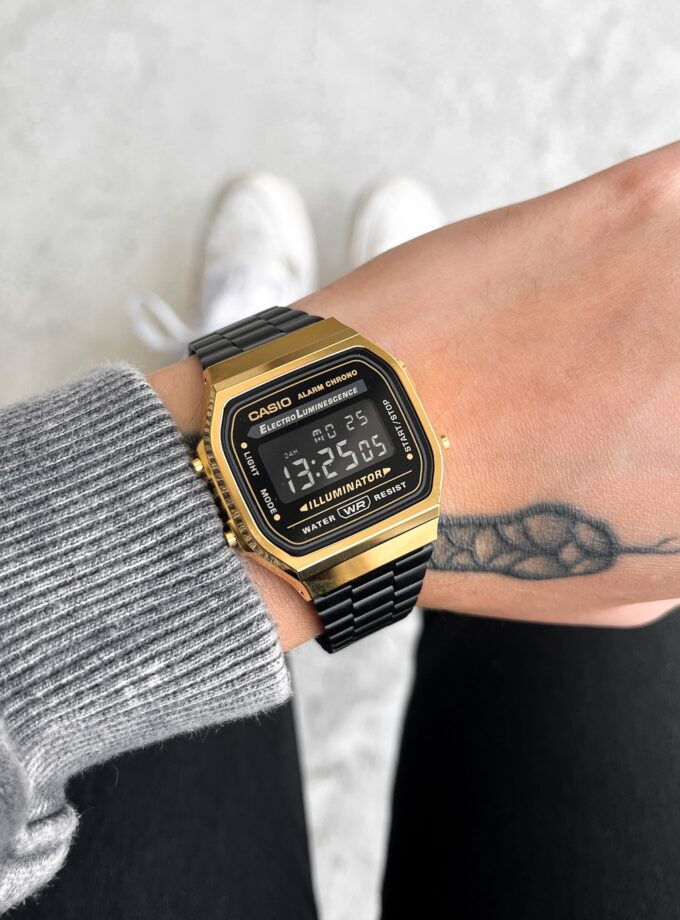 Montre CASIO Unisexe - Bracelet Noir En Acier Inoxydable - Résistante à l'eau - 12 Mois De Garantie - A168WEGB-1BDF