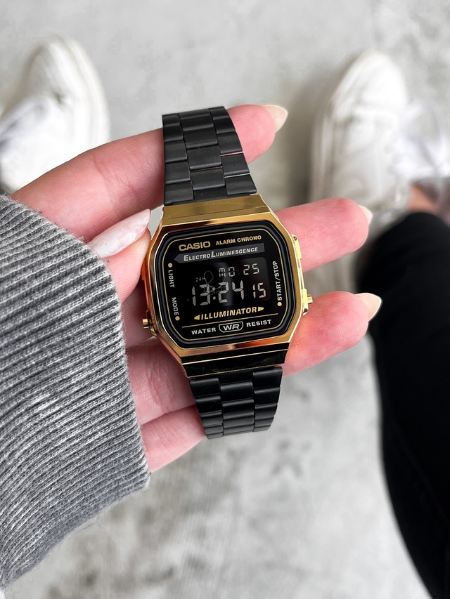 Montre CASIO Unisexe - Bracelet Noir En Acier Inoxydable - Résistante à l'eau - 12 Mois De Garantie - A168WEGB-1BDF