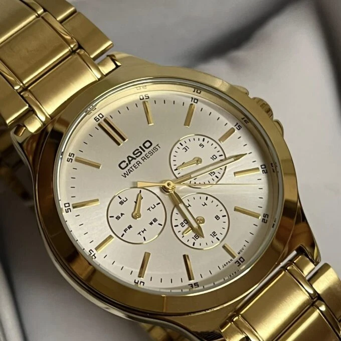 Montre CASIO Homme - Bracelet DoRée En Acier Inoxydable - Cadran Blanc - 12 Mois De Garantie - MTP-V300G-7AUDF