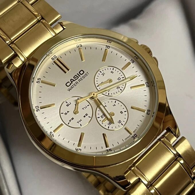 Montre CASIO Homme - Bracelet DoRée En Acier Inoxydable - Cadran Blanc - 12 Mois De Garantie - MTP-V300G-7AUDF